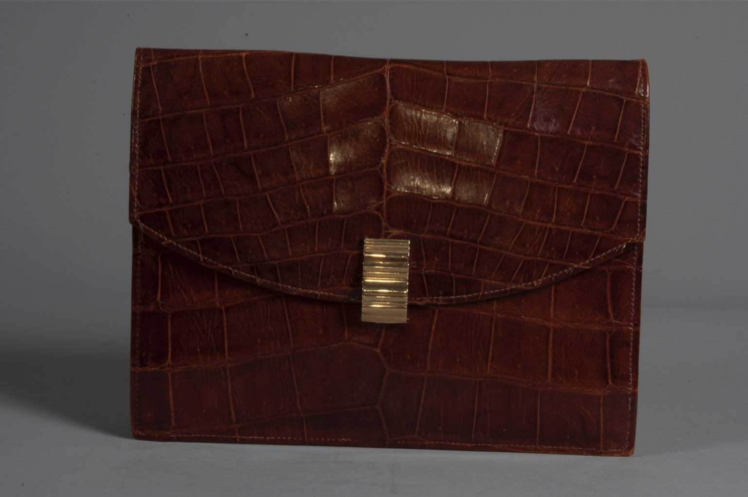 Lot 98 - A Cartier alligator clutch bag, circa 1938-40,...