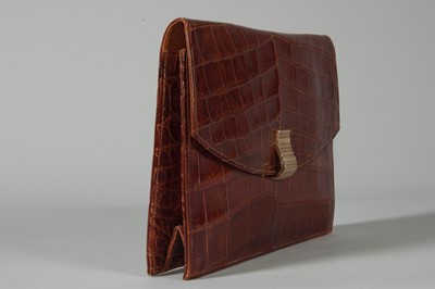 Lot 98 - A Cartier alligator clutch bag, circa 1938-40,...