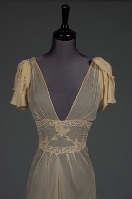 Lot 87 - A lemon chiffon nightdress, late 1930s-mid...