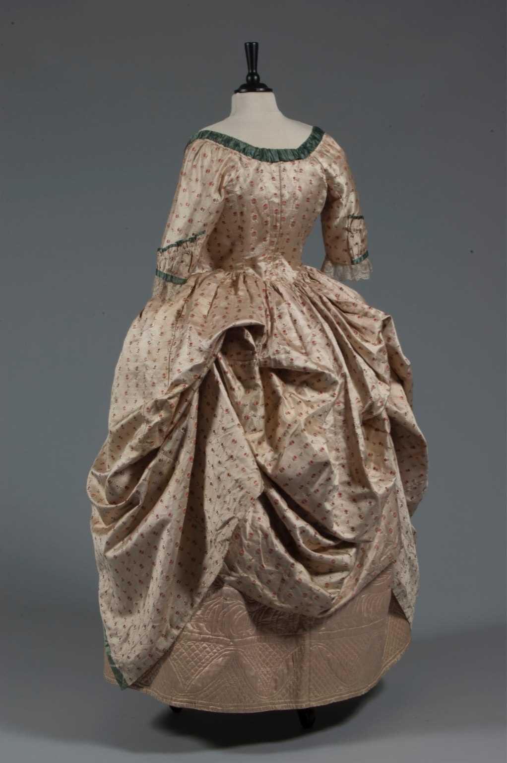 Lot 45 - A brocaded silk open robe 'à la polonaise',...