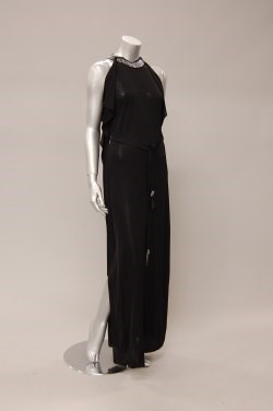 Lot 242 - A Loris Azzaro black jersey evening gown, late...