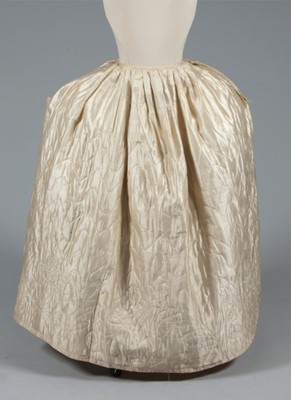 Lot 49 - A quilted ivory silk petticoat, circa 1760-80,...