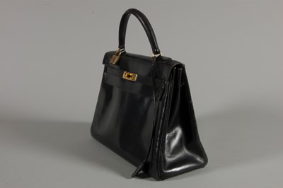 Lot 7 - An Hermès black leather Kelly bag, circa 1960,...