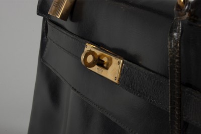 Lot 7 - An Hermès black leather Kelly bag, circa 1960,...
