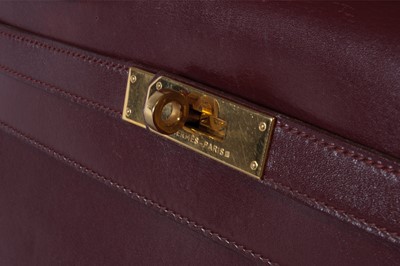Lot 3 - A large Hermès burgundy leather Kelly bag,...