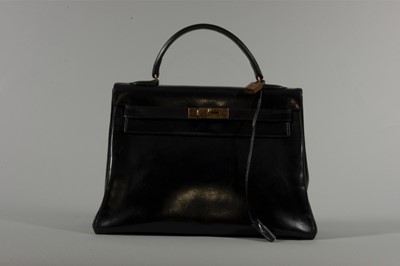Lot 15 - An Hermès black box-leather Kelly bag, 1960s,...