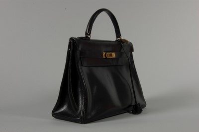Lot 15 - An Hermès black box-leather Kelly bag, 1960s,...