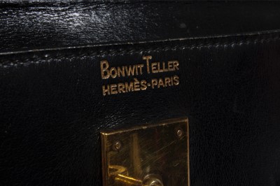 Lot 15 - An Hermès black box-leather Kelly bag, 1960s,...