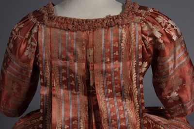 Lot 42 - A brocaded cinnamon satin robe à la française,...