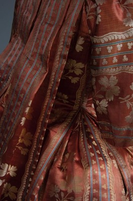 Lot 42 - A brocaded cinnamon satin robe à la française,...
