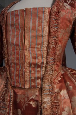 Lot 42 - A brocaded cinnamon satin robe à la française,...