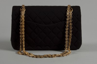 Lot 6 - A Chanel quilted black jersey 2.55 bag, 1980s,...
