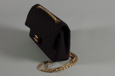 Lot 6 - A Chanel quilted black jersey 2.55 bag, 1980s,...