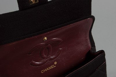 Lot 6 - A Chanel quilted black jersey 2.55 bag, 1980s,...