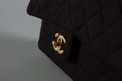 Lot 6 - A Chanel quilted black jersey 2.55 bag, 1980s,...
