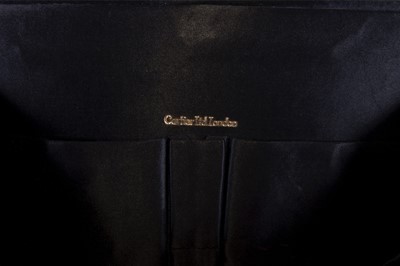 Lot 16 - A Cartier gold mounted black silk grosgrain...