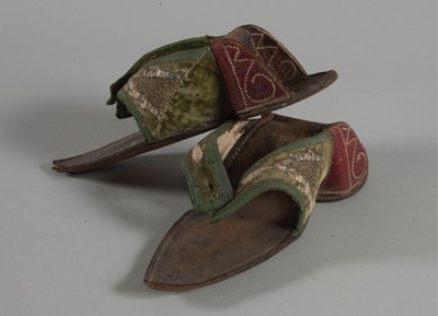 Lot 30 - A pair of embroidered green velvet pattens,...