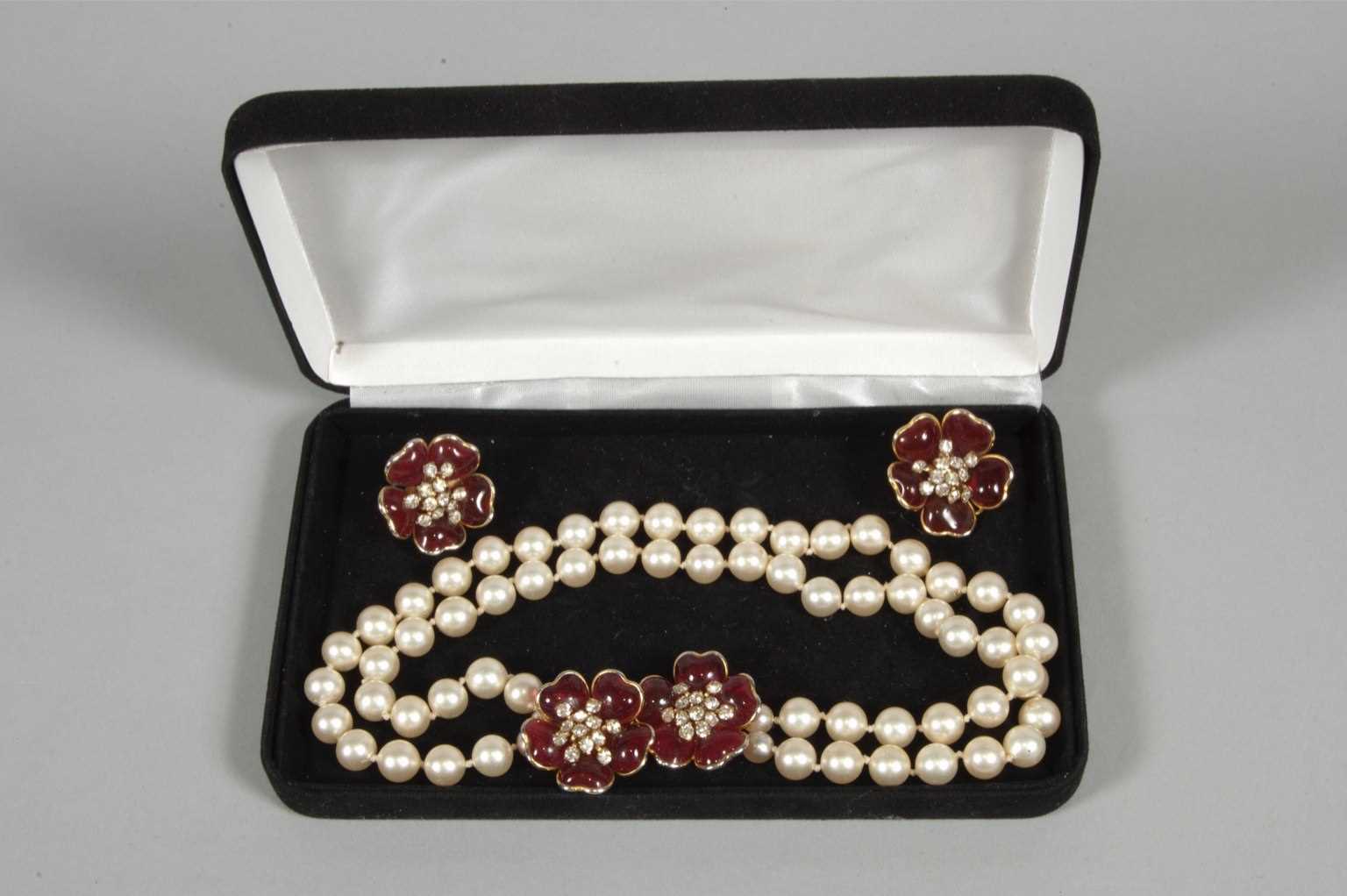 Lot 14 - A faux pearl double strand necklace and...