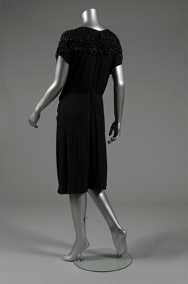 Lot 124 - A Gilbert Adrian beaded black wool crepe...