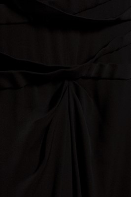 Lot 124 - A Gilbert Adrian beaded black wool crepe...