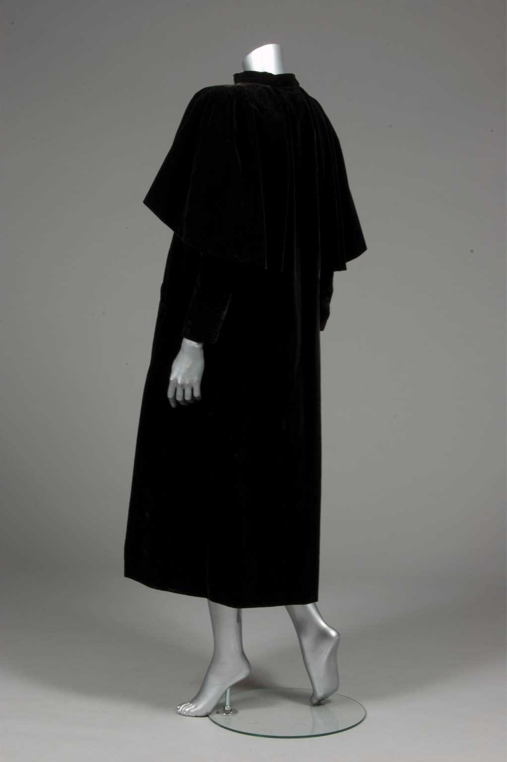 Lot 81 - A Balenciaga couture black velvet redingote,...