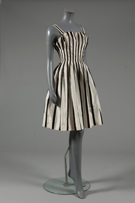 Lot 128 - A Pierre Balmain couture black satin and ivory...