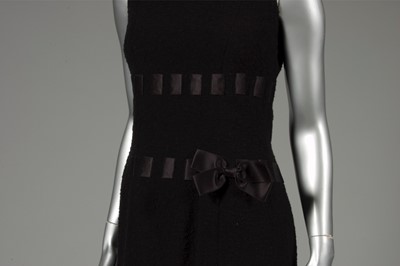 Lot 137 - A Pierre Balmain black bouclé wool dinner gown,...