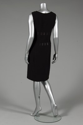 Lot 137 - A Pierre Balmain black bouclé wool dinner gown,...