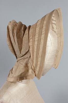 Lot 32 - A purple silk caleche bonnet, late 18th...