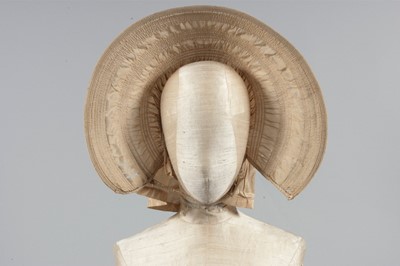 Lot 32 - A purple silk caleche bonnet, late 18th...
