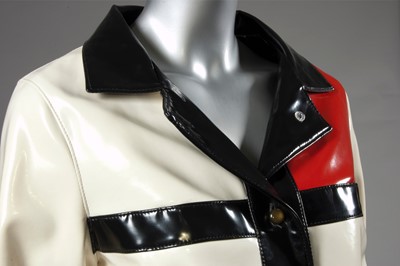 Lot 168 - A vinyl Mondrian-style coat, mid 1960s,...