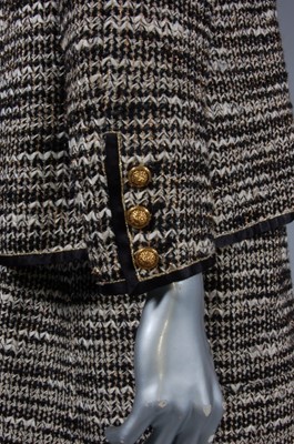 Lot 171 - A Chanel couture suit, 1960s, labelled and...