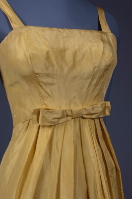 Lot 150 - A Givenchy haute couture brilliant yellow silk...