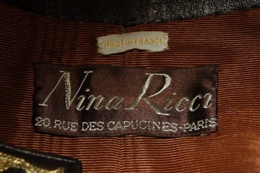Lot 217 - A Nina Ricci embroidered brown leather evening...