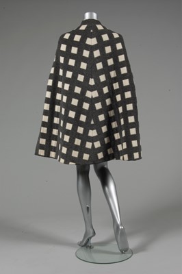 Lot 212 - A Pauline Trigre woven window-pane cape, 1974,...