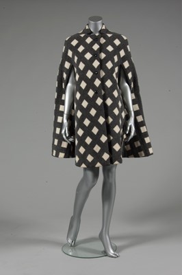 Lot 212 - A Pauline Trigre woven window-pane cape, 1974,...