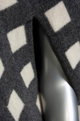 Lot 212 - A Pauline Trigre woven window-pane cape, 1974,...