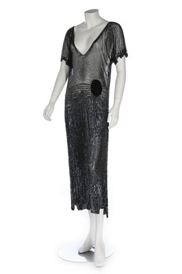 Lot 122 - A black beaded and sequinned tulle evening...