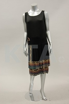 Lot 123 - A black satin flapper dress, mid 1920s, with...