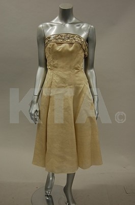Lot 130 - An ivory organza evening/bridal gown, circa...