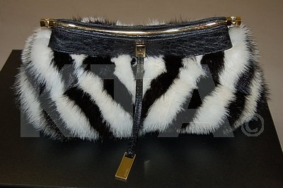 Lot 17 - A Gucci striped mink and ostrich leather bag,...