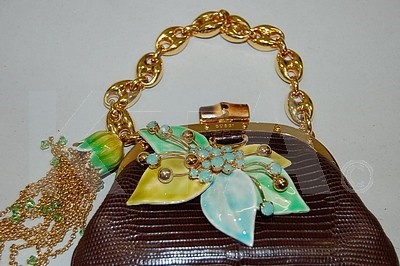 Lot 18 - A Gucci brown lizard purse, with chunky gilt...