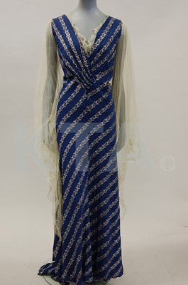 Lot 89 - Two 1930s evening gowns, the first of blue...