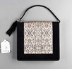 Lot 10 - A Cartier black suede and brocade evening bag,...