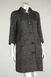 Lot 163 - A Balenciaga black matelasse evening coat,...