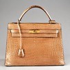 Lot 4 - An Hermès light tan crocodile Kelly bag, circa...