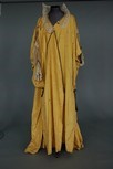 Lot 66 - An embroidered yellow silk tea gown, circa...