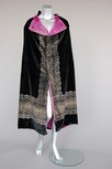 Lot 92 - A Maria Gallenga black stencilled velvet cape,...