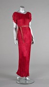 Lot 90 - A Mariano Fortuny raspberry-pink silk Delphos...