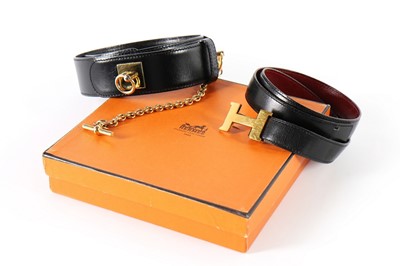 Lot 379 - An Hermès leather belt, 1981, black reversing...